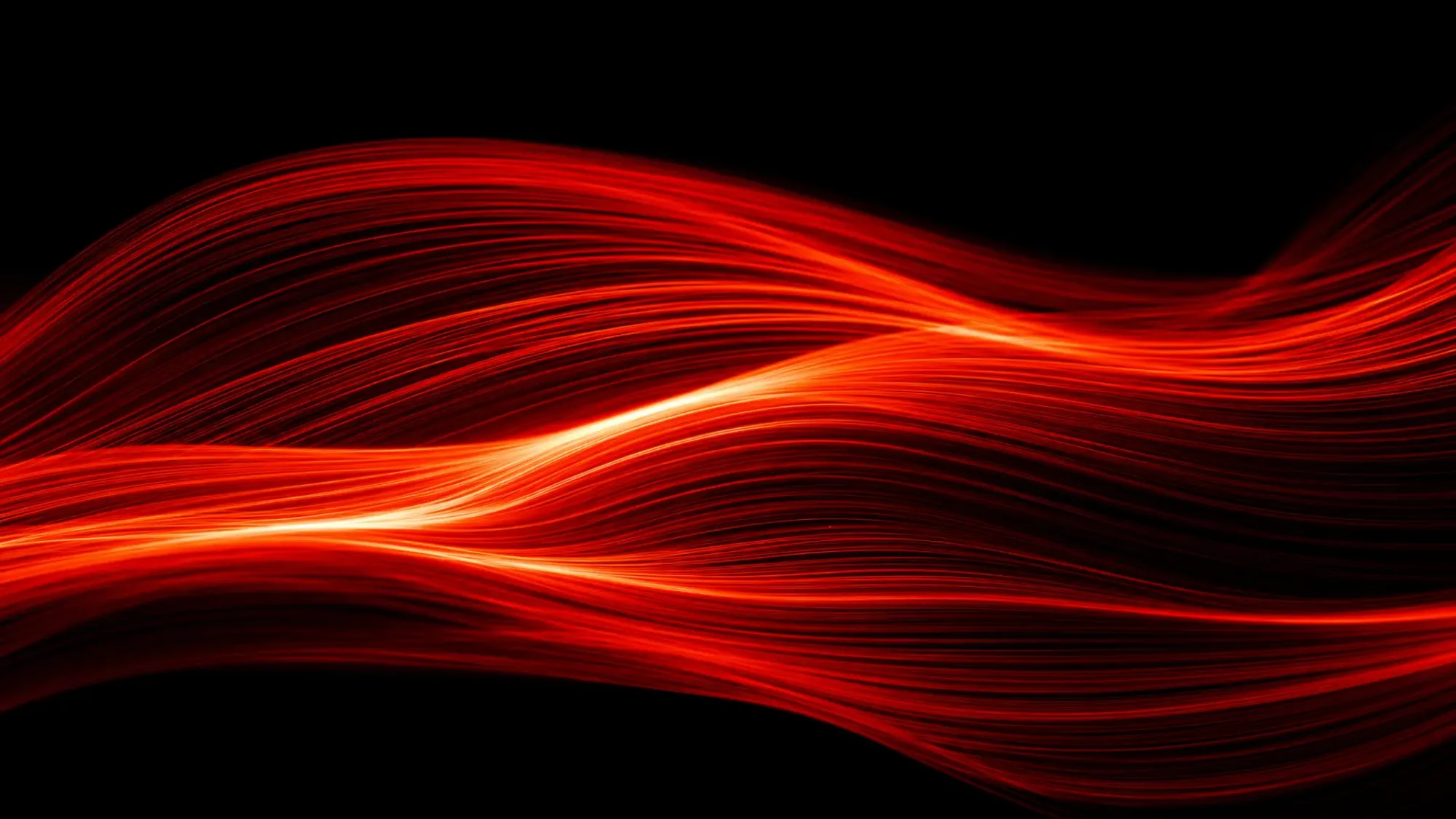 Red ribbons of light sweeping across a black background